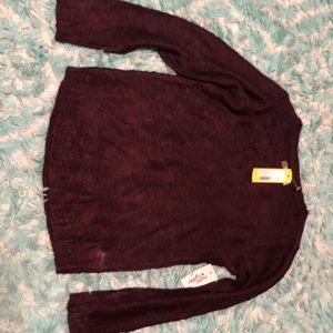 A dark purple sweater.